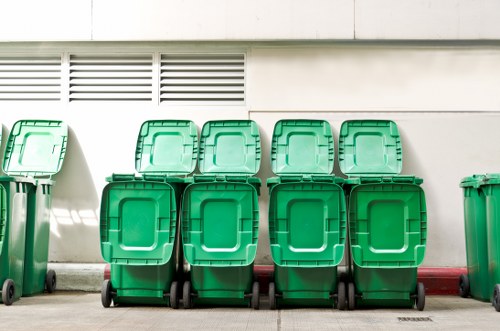 Professional waste clearance truck at a building site